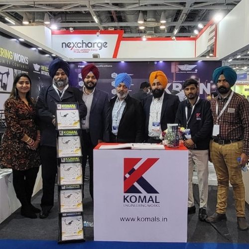 Komal Engineering Works team with booth display